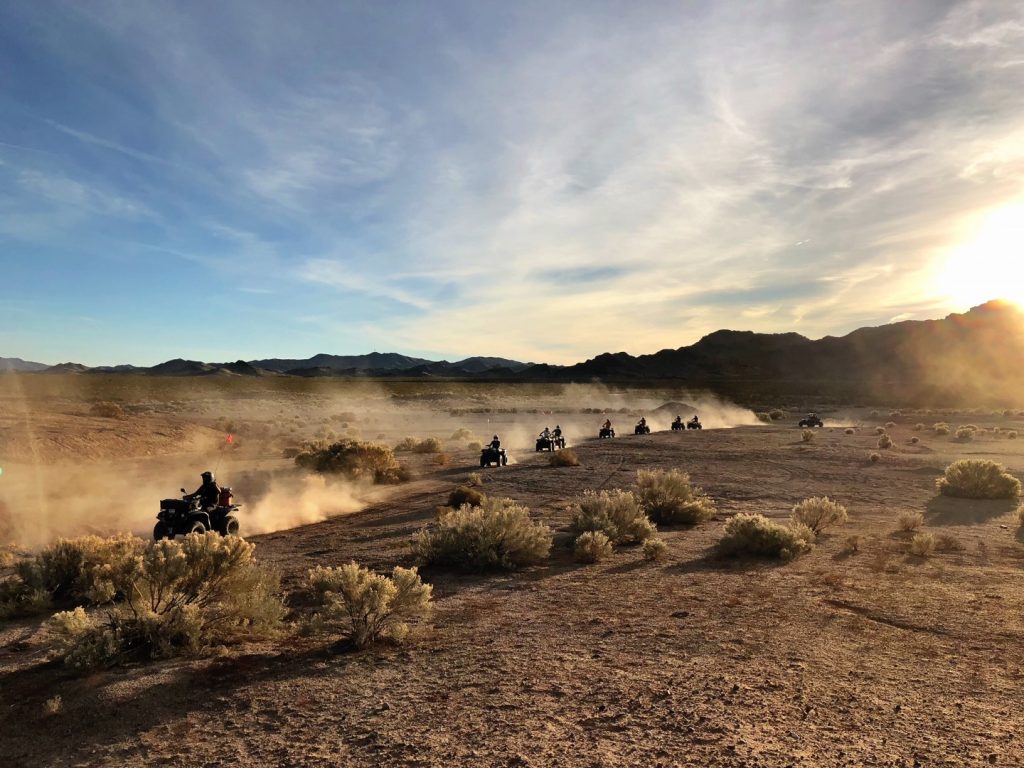 Drivers on ATVs riding through Mojave Desert